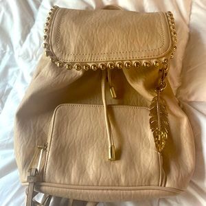 Rose gold purse backpack